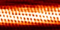 Individual carbon atoms are visible in this image of a carbon nanotube made by a scanning tunneling electron microscope.