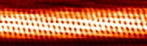 Individual carbon atoms are visible in this image of a carbon nanotube made by a scanning tunneling electron microscope.